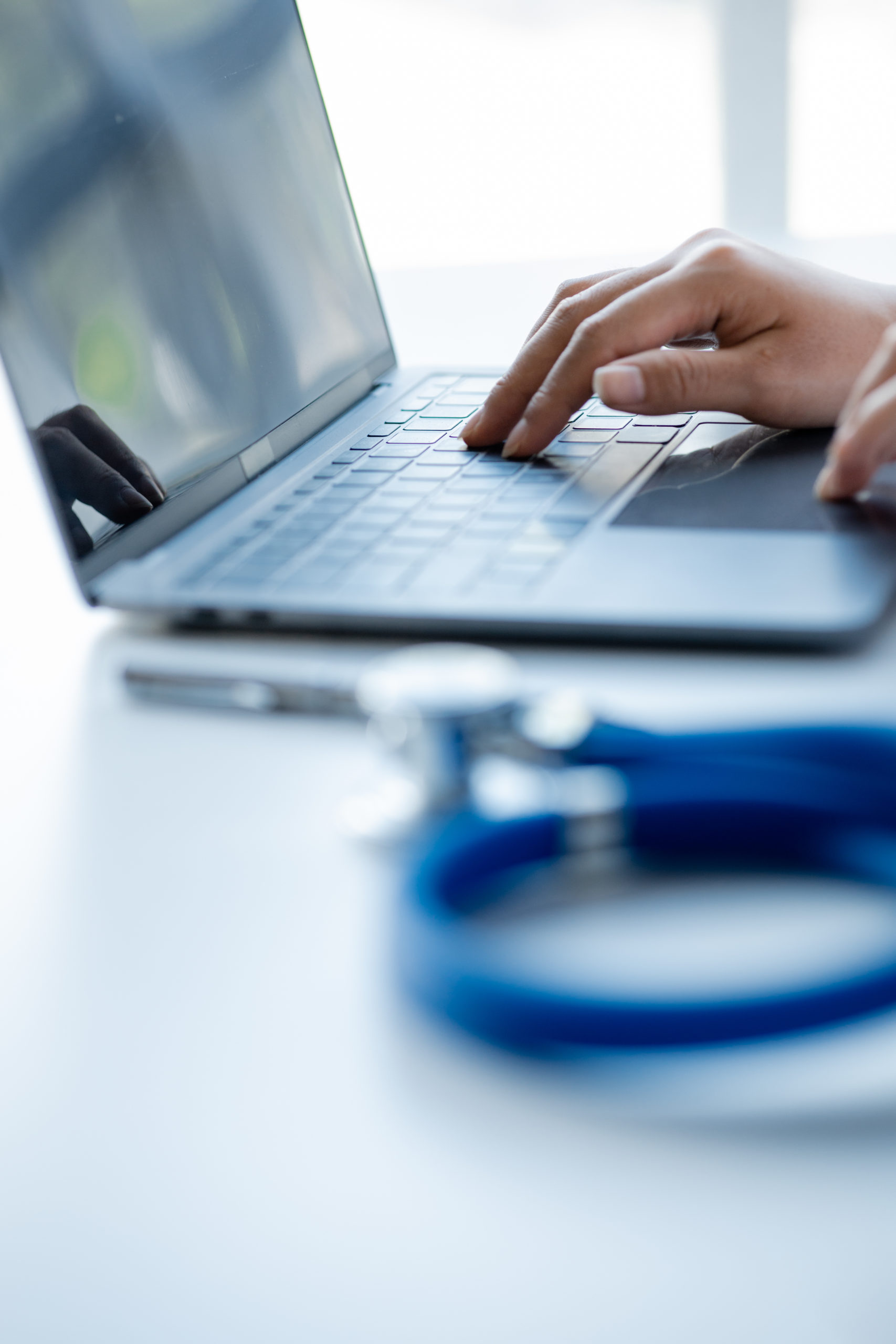 Doctors print treatment reports onto laptops in the hospital room, treating diseases from specialists and providing targeted treatment. Concepts of medical treatment and specialists.